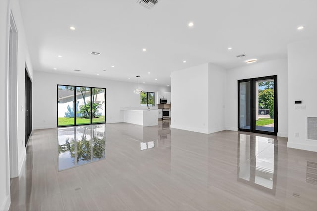 3920 Espan Ct, Palm Springs, FL 33461 - unfurnished room with plenty of natural light and recessed lighting