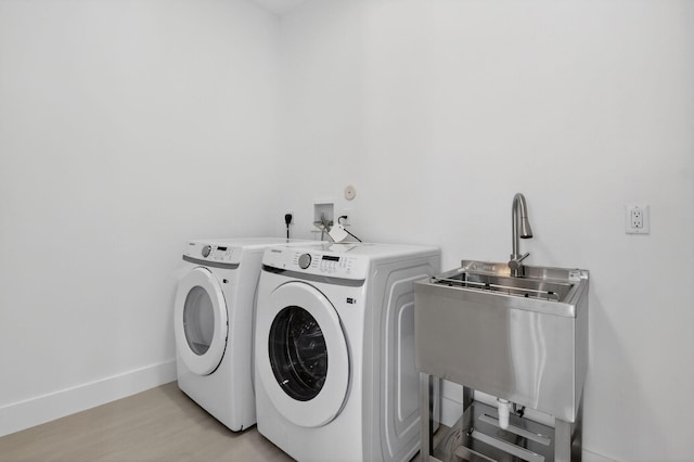 3920 Espan Ct, Palm Springs, FL 33461 - laundry area featuring separate washer and dryer and light wood-style floors