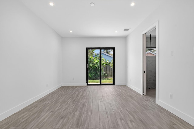 3920 Espan Ct, Palm Springs, FL 33461 - empty room with recessed lighting and wood finished floors