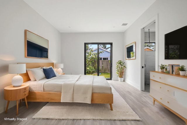 3920 Espan Ct, Palm Springs, FL 33461 - bedroom featuring light wood-type flooring and access to outside