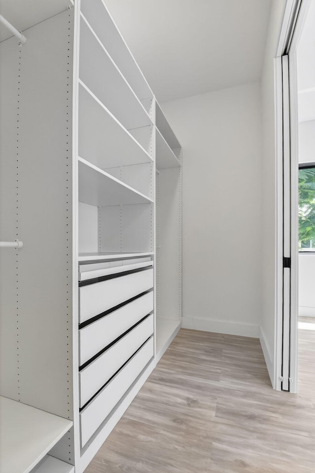 3920 Espan Ct, Palm Springs, FL 33461 - spacious closet featuring wood finished floors