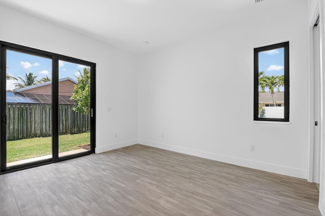 3920 Espan Ct, Palm Springs, FL 33461 - empty room featuring light wood-type flooring