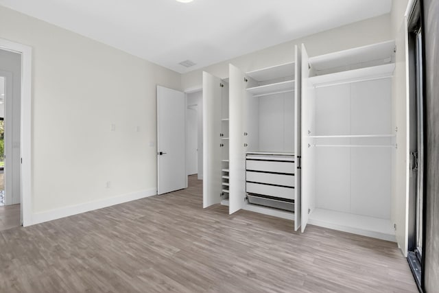 3920 Espan Ct, Palm Springs, FL 33461 - unfurnished bedroom featuring wood finished floors and a closet