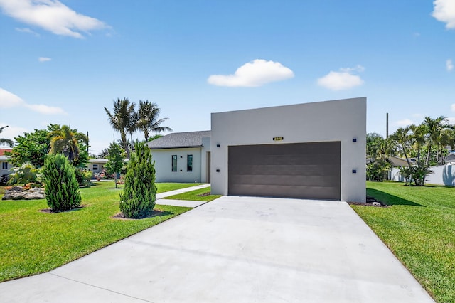 3920 Espan Ct, Palm Springs, FL 33461 - modern home featuring stucco siding, an attached garage, driveway, and a front lawn
