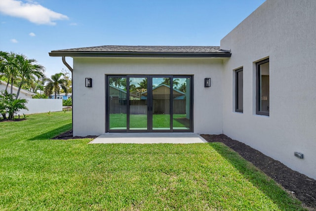 3920 Espan Ct, Palm Springs, FL 33461 - back of property with a lawn and stucco siding