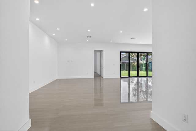 3920 Espan Ct, Palm Springs, FL 33461 - empty room with recessed lighting and light wood-style floors