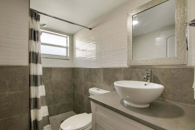 705 Lori Dr Unit 104, Palm Springs, FL 33461 - full bathroom featuring tile walls, tiled shower, toilet, and vanity