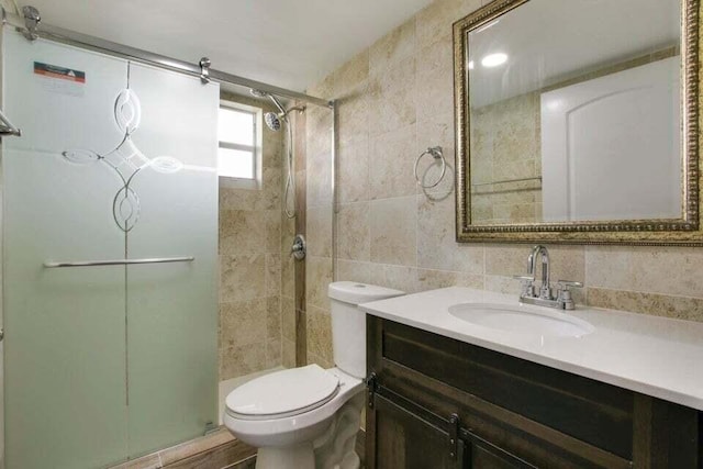 705 Lori Dr Unit 104, Palm Springs, FL 33461 - full bathroom featuring tile walls, tiled shower, toilet, and vanity