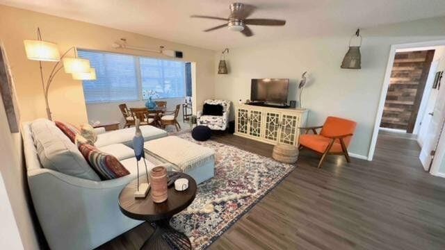 705 Lori Dr Unit 104, Palm Springs, FL 33461 - living room featuring wood finished floors, a ceiling fan, and baseboards