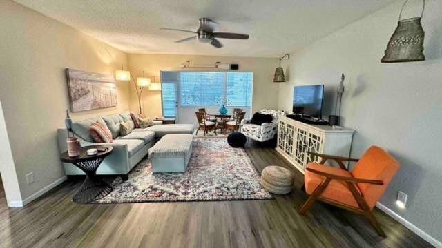 705 Lori Dr Unit 104, Palm Springs, FL 33461 - living area with wood finished floors, ceiling fan, and baseboards
