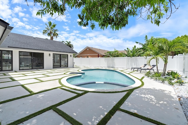 3701 NW 8th St, Delray Beach, FL 33445 - view of pool with a patio area, a fenced backyard, and a pool with connected hot tub