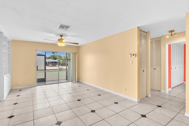 2765 Ashley Dr W Unit C, West Palm Beach, FL 33415 - spare room featuring a ceiling fan and baseboards