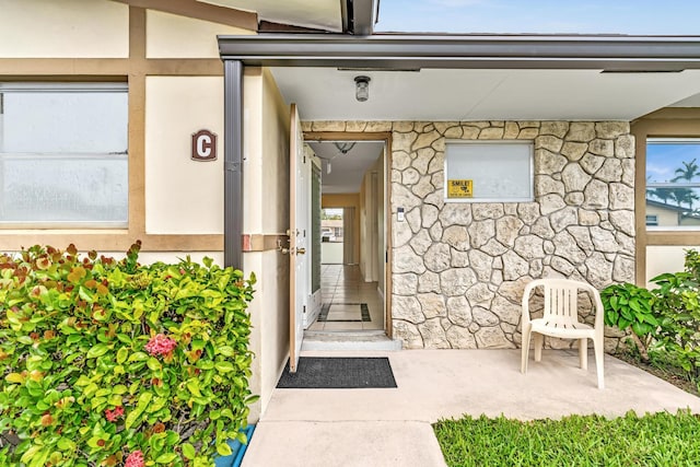 2765 Ashley Dr W Unit C, West Palm Beach, FL 33415 - view of exterior entry featuring stone siding