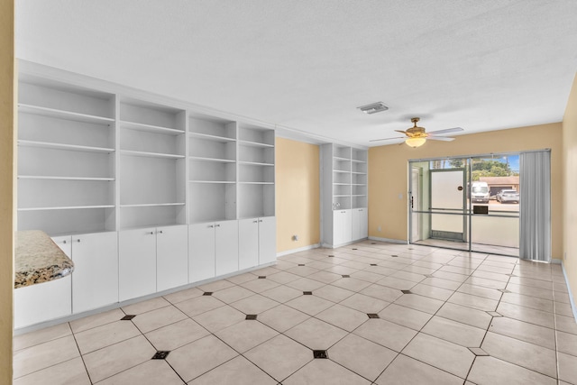2765 Ashley Dr W Unit C, West Palm Beach, FL 33415 - empty room featuring built in shelves and a ceiling fan