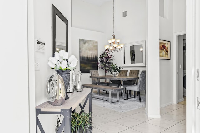 6392 Long Key Ln, Boynton Beach, FL 33472 - dining area with a chandelier, a towering ceiling, and light tile patterned floors
