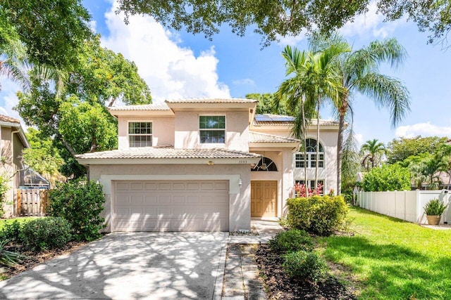 3995 Majestic Palm Way, Delray Beach, FL 33445 - mediterranean / spanish home featuring stucco siding, driveway, solar panels, an attached garage, and a tile roof
