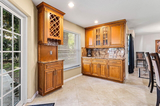 3995 Majestic Palm Way, Delray Beach, FL 33445 - bar featuring tasteful backsplash, recessed lighting, and light tile patterned flooring