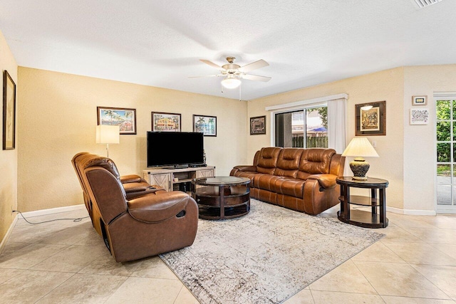 3995 Majestic Palm Way, Delray Beach, FL 33445 - living area with a ceiling fan, healthy amount of natural light, light tile patterned floors, and a textured ceiling
