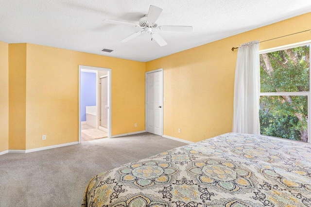 3995 Majestic Palm Way, Delray Beach, FL 33445 - bedroom featuring carpet, ensuite bath, a ceiling fan, and a textured ceiling