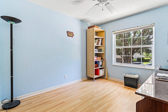 3995 Majestic Palm Way, Delray Beach, FL 33445 - office area featuring wood finished floors, a textured wall, a ceiling fan, and a textured ceiling