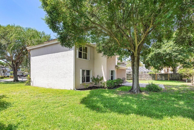 3995 Majestic Palm Way, Delray Beach, FL 33445 - rear view of property with stucco siding