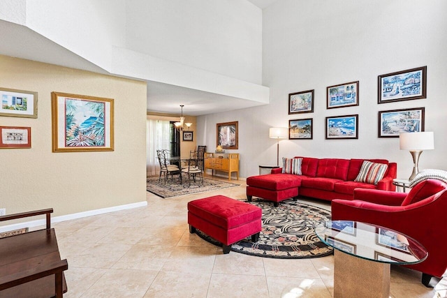 3995 Majestic Palm Way, Delray Beach, FL 33445 - living room with a high ceiling, a chandelier, and light tile patterned flooring