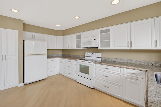 19630 Sawgrass Cir Unit 2901, Boca Raton, FL 33434 - kitchen featuring white appliances, light wood-style floors, white cabinets, glass insert cabinets, and recessed lighting