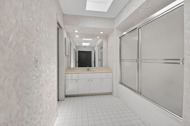 19630 Sawgrass Cir Unit 2901, Boca Raton, FL 33434 - bathroom featuring a skylight, vanity, tile patterned floors, and enclosed tub / shower combo
