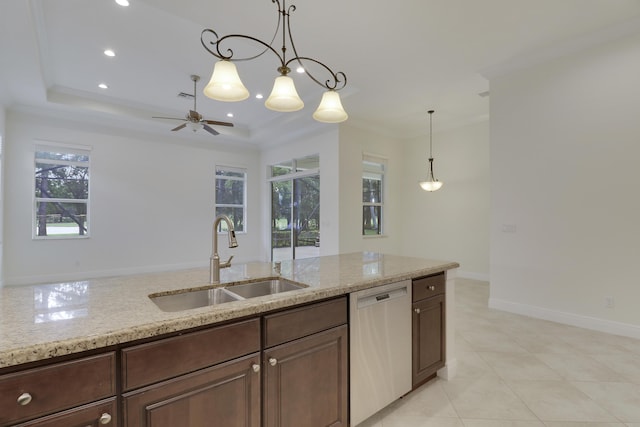 10479 SW Visconti Way, Port Saint Lucie, FL 34986 - kitchen featuring stainless steel dishwasher, a ceiling fan, a raised ceiling, light stone counters, and decorative light fixtures