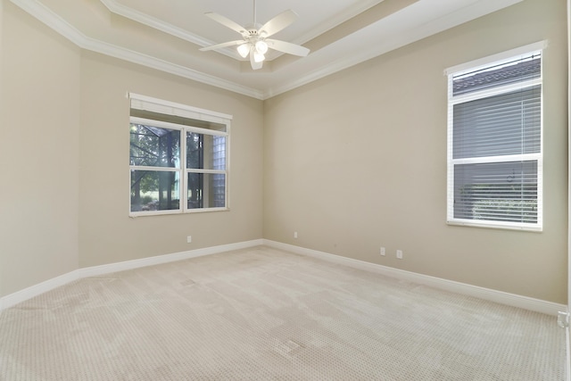 10479 SW Visconti Way, Port Saint Lucie, FL 34986 - unfurnished room with ornamental molding, a tray ceiling, light carpet, and a ceiling fan