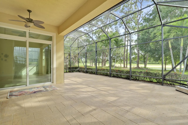 10479 SW Visconti Way, Port Saint Lucie, FL 34986 - view of patio / terrace with glass enclosure, ceiling fan, and view of scattered trees
