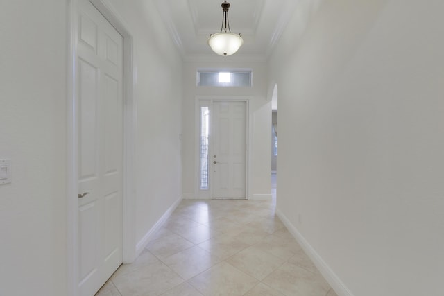 10479 SW Visconti Way, Port Saint Lucie, FL 34986 - entryway featuring crown molding, light tile patterned floors, arched walkways, and a high ceiling