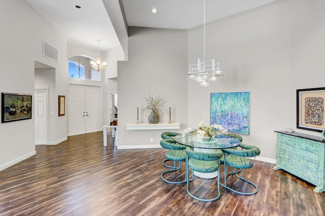 3346 NW 53rd Cir, Boca Raton, FL 33496 - dining space with a chandelier, a high ceiling, and wood finished floors