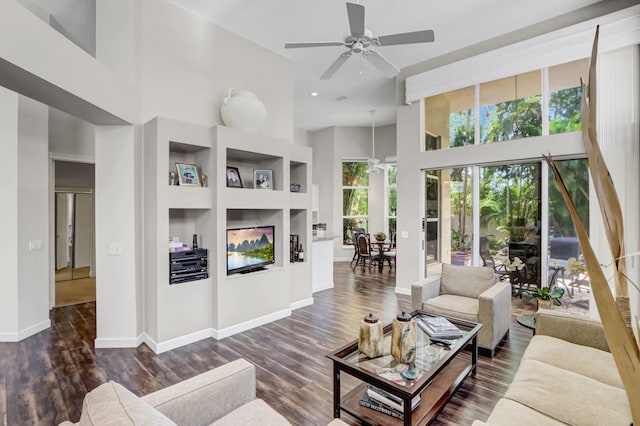 3346 NW 53rd Cir, Boca Raton, FL 33496 - living area with ceiling fan, a towering ceiling, built in shelves, and wood finished floors