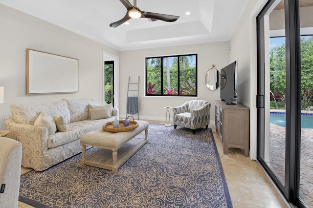 425 NW 12th St, Delray Beach, FL 33444 - living area featuring a raised ceiling, ceiling fan, light tile patterned floors, crown molding, and recessed lighting