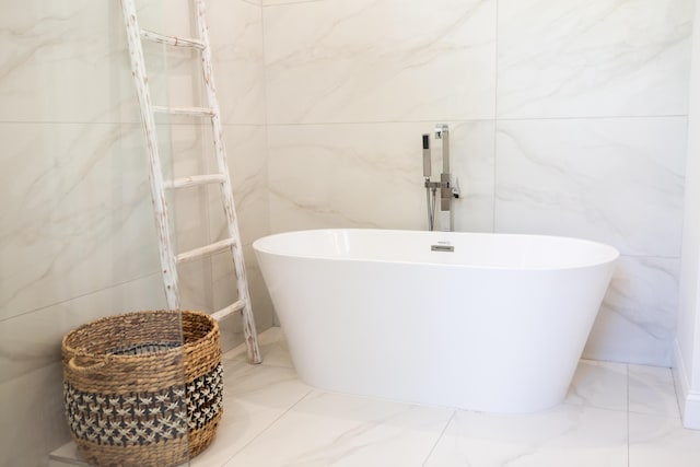 425 NW 12th St, Delray Beach, FL 33444 - full bath with tile walls, a freestanding tub, and marble finish floors