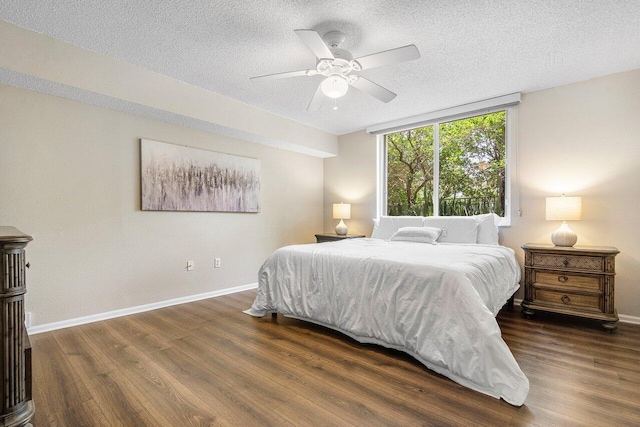 800 Scotia Dr Unit 102, Hypoluxo, FL 33462 - bedroom featuring a textured ceiling, wood finished floors, and ceiling fan