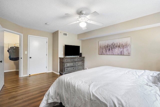 800 Scotia Dr Unit 102, Hypoluxo, FL 33462 - bedroom with wood finished floors, a ceiling fan, and a textured ceiling