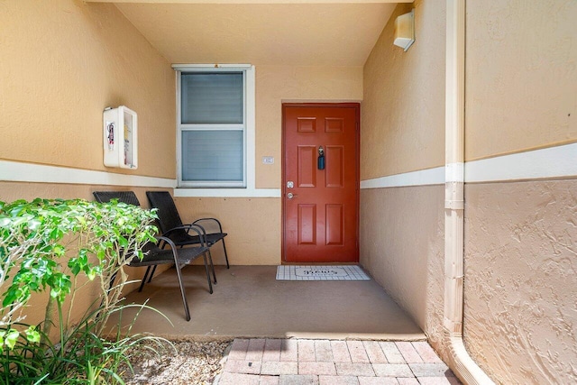 800 Scotia Dr Unit 102, Hypoluxo, FL 33462 - view of exterior entry featuring stucco siding