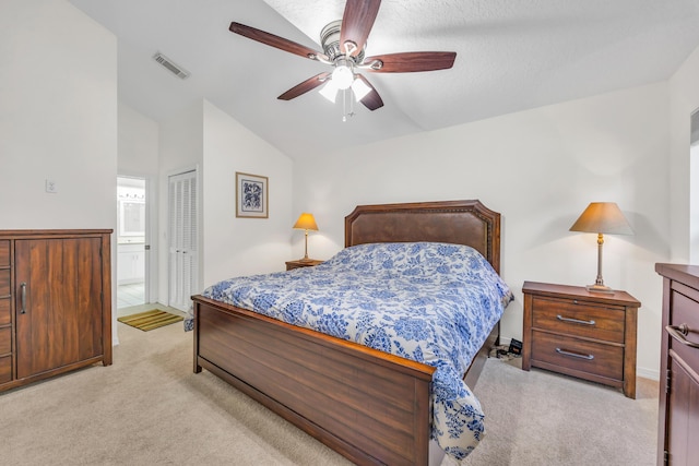 4386 SE Scotland Cay Way, Stuart, FL 34997 - bedroom featuring light colored carpet, vaulted ceiling, a closet, a ceiling fan, and ensuite bath