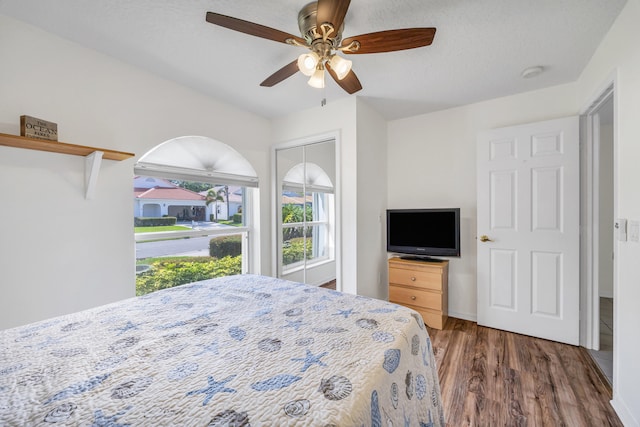 4386 SE Scotland Cay Way, Stuart, FL 34997 - bedroom with wood finished floors, ceiling fan, and a closet