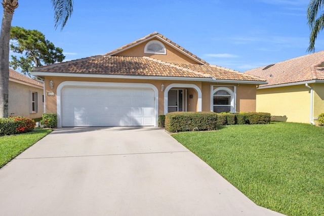 4386 SE Scotland Cay Way, Stuart, FL 34997 - mediterranean / spanish-style house featuring stucco siding, a front yard, a garage, driveway, and a tiled roof