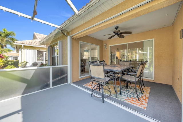 4386 SE Scotland Cay Way, Stuart, FL 34997 - view of patio / terrace with ceiling fan, outdoor dining space, and glass enclosure