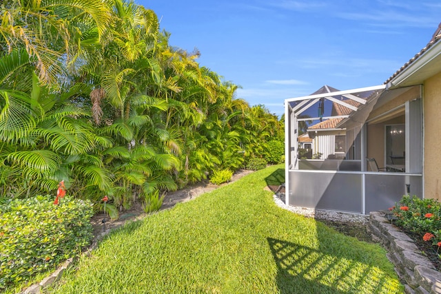 4386 SE Scotland Cay Way, Stuart, FL 34997 - view of grassy yard featuring a lanai