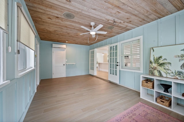 1567 NE Sottong Ave, Jensen Beach, FL 34957 - unfurnished sunroom featuring a wall unit AC and french doors