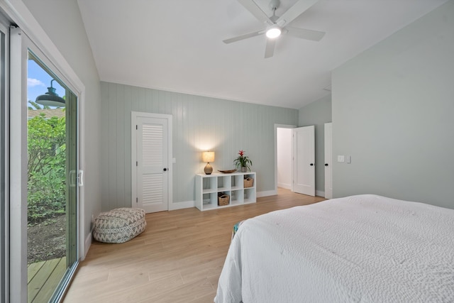 1567 NE Sottong Ave, Jensen Beach, FL 34957 - bedroom featuring lofted ceiling, light wood-style flooring, ceiling fan, access to outside, and baseboards