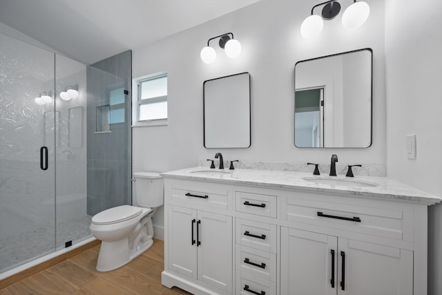 1567 NE Sottong Ave, Jensen Beach, FL 34957 - full bath with toilet, a shower stall, double vanity, and wood finished floors
