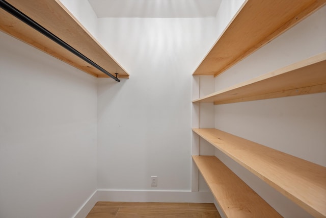 1567 NE Sottong Ave, Jensen Beach, FL 34957 - spacious closet featuring wood finished floors