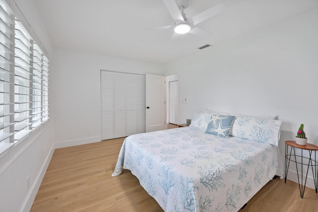 1567 NE Sottong Ave, Jensen Beach, FL 34957 - bedroom with multiple windows, wood finished floors, baseboards, and a ceiling fan