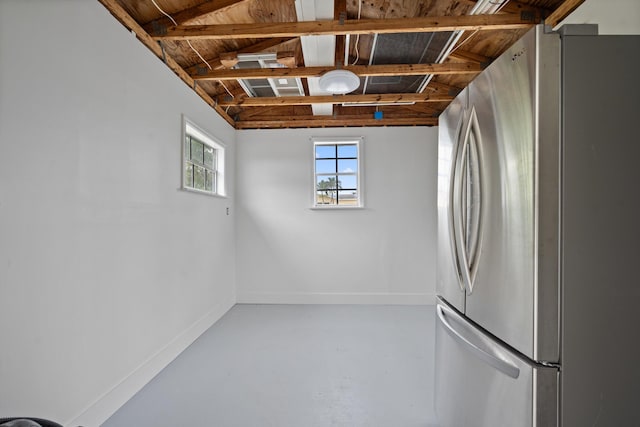 1567 NE Sottong Ave, Jensen Beach, FL 34957 - below grade area featuring freestanding refrigerator and baseboards